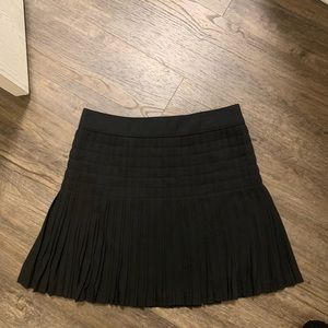 J. Crew Black pleated mini skirt.